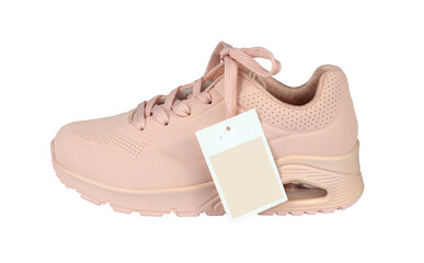 Woman's sneaker with a sale tag or a price card isolated from background. Pink color. Profile view
