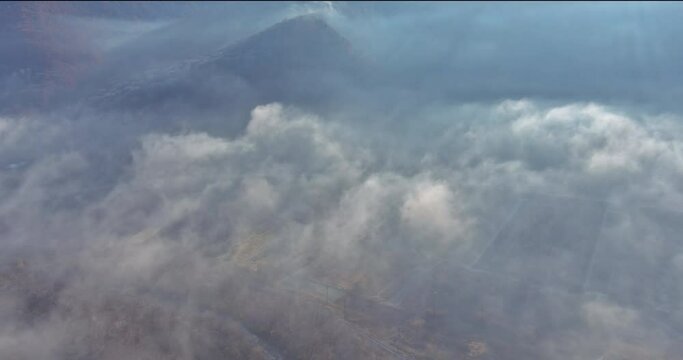 In autumn Carpathians mountain range transforms into captivating landscape with misty fog veiling morning forest.