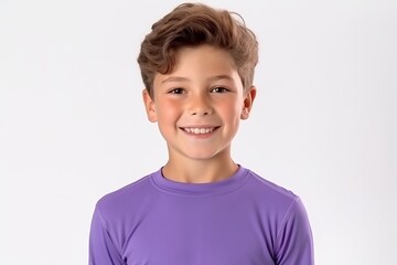 Portrait of a smiling boy in a purple t-shirt on a white background. - obrazy, fototapety, plakaty