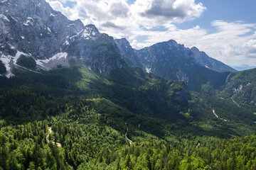 Naklejka na ściany i meble Alpine mountains landscape. Aerial drone view Beauty in nature. Italian Alps