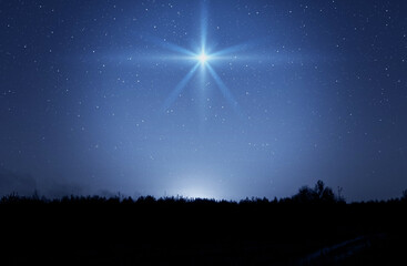 Christmas star. Background of the beautiful nite dark starry sky and bright star. Nativity of Bethlehem, Nativity of Jesus Christ. - 615574186