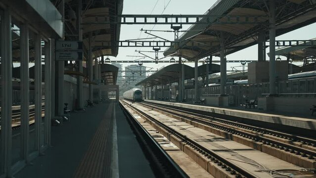 4K footage of railway platform and station in daylight stock video.