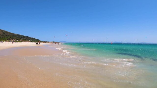 Kitesurfing on Valdevaqueros beach, Gibraltar Strait in Tarifa, Spain on June 17, 2023