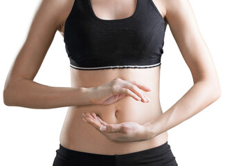 Female in a sports bra making a circle with her hands around her abdomen