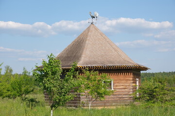 Fototapeta na wymiar A wooden house was built in the field