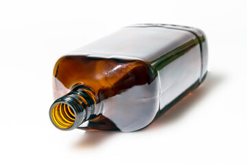 Empty brown bottle on a white background