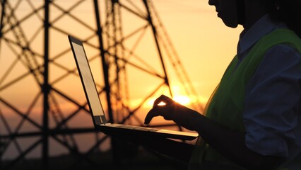 silhouette electrical engineer, work computer tablet sunset, electric tower, digital hand, engineer...
