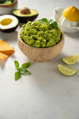 Guacamole avocado mash dip, with tortilla chips. Copy space