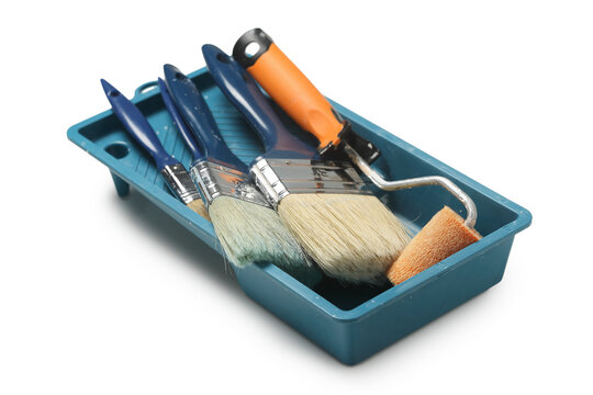 tray with used paint brushes and rollers isolated