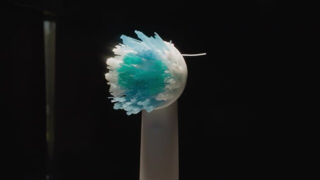 Tip Of Used Electric Toothbrush With Colorful Hard Bristle