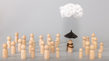 Psychology, solitude, fear or mental health problem concept. Depressed sad person with a cloud overhead, surrounded by normal people on grey background 