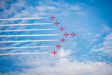 Aircraft in formation at an air show - Powered by Adobe
