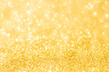 Gold glitter defocused texture background. gold christmas abstract background.