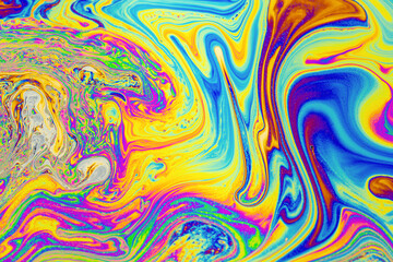 Obraz premium Psychedelic multicolored background abstract. Rainbow colors. patterns background. Photo macro shot of soap bubbles