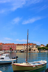 Fototapeta na wymiar Small picturesque boats in the port of Supetar, on island Brac, Croatia. Sunny summer day.