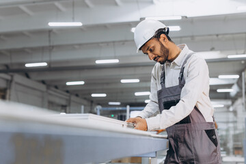 PVC industry worker making PVC frames for windows and doors