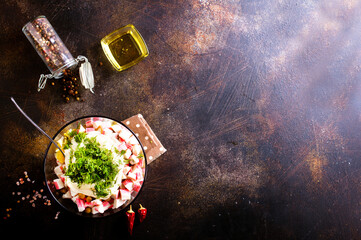 Salad of crab sticks, cheese, garlic and tomatoes, dressed with mayonnaise © tycoon101