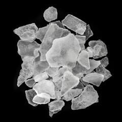 Bhimseni camphor peaces isolated on black background