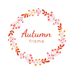 Round frame with orange and yellow berries. Bright autumn wreath with gbranches
