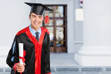 Happy young graduate student celebrating