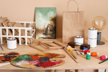 Table with artist's supplies in studio