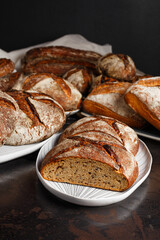 Fresh healthy bread food group in studio on table with dark background