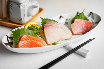 fresh sashimi (Raw fish) set in a plate, Japanese popular tradition food