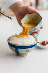 Natto (fermented soybeans) drawing sticky strings on chopsticks,Traditional Japanese food