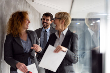 Group of business people walking at office