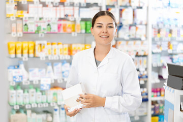 There is pharmacist in baby food department and shows baby formula for toddlers. Wide selection of dairy and lactose-free infant formula, puree for complementary foods