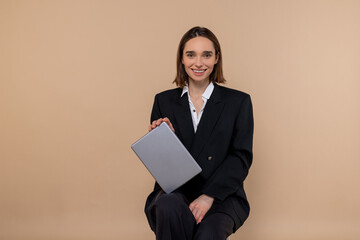 Cute young business woman looking excited and smiling