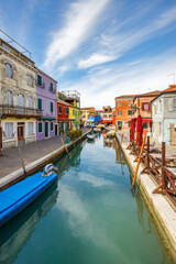 Fototapeta na wymiar The canal with colorful houses on The Burano island near Venice, Italy, Europe.