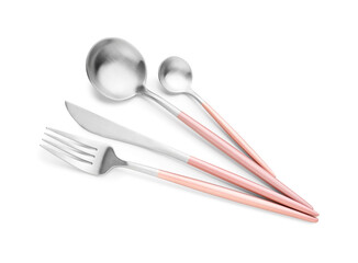 Stainless steel set of cutlery with pink handles on white background