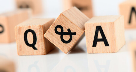 Q and A - short for question and answer. The word q and a arranged from wooden letters.