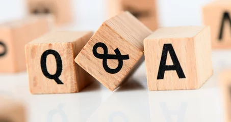 Fotobehang Q and A - short for question and answer. The word q and a arranged from wooden letters. © roobcio