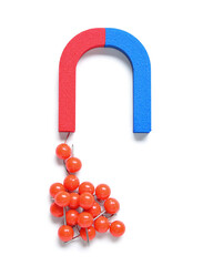 Magnet attracting pins on white background