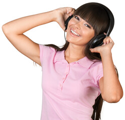Naklejka premium Young woman listening to music with headphones on white background