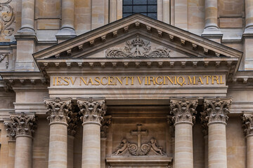 Fototapeta premium Architectural fragments of Paris Val-de-Grace Church at Place Alphonse Laveran. Сhurch and monastery of Val-de-Grace was built in middle of XVII th century by Queen Anne of Austria. Paris. France.