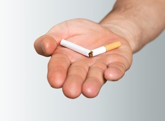 Stop smoking concept, Hand with broken cigarette