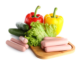 Board with tasty thin sausages and fresh vegetables on white background