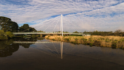 suspension bridge river reflection 
