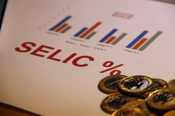 Taxa Selic - Gráfico representando evolução e algumas moedas de Real.