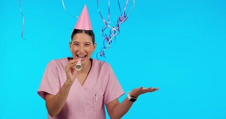 Birthday, party horn and balloons with a woman nurse in studio isolated on a blue background for celebration. Portrait, healthcare and a happy female medicine professional blowing on a noisemaker