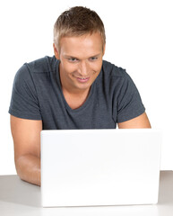 Portrait of young handsome businessman using laptop isolated on white background