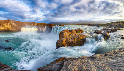 Breathtaking landscape scene of powerful Godafoss waterfall.