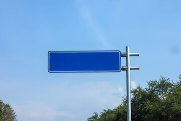Blank road sign on blue sky background.  blue road sign to pass your information