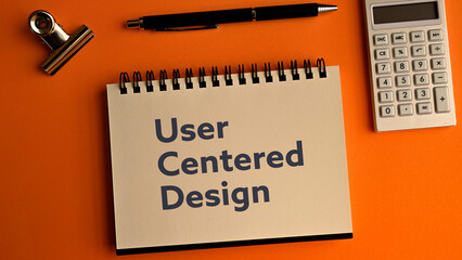 There is notebook with the word User Centered Design. It is as an eye-catching image.