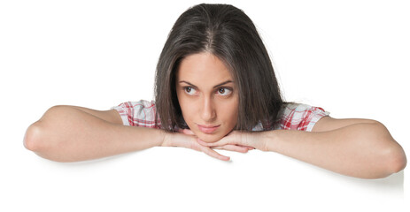 Fototapeta premium Young woman resting her arms on top of a blank sign