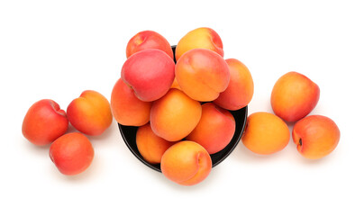 Bowl with ripe apricots isolated on white background