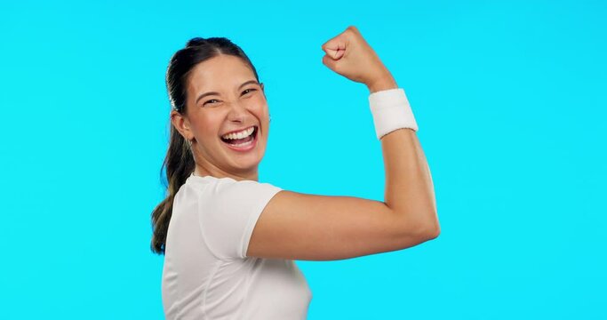 Woman, face and exercise for flexing, strong arms and muscle for smile, excited and pride by blue background. Girl bodybuilder, happy and bicep with comic laughing for success, fitness and goals